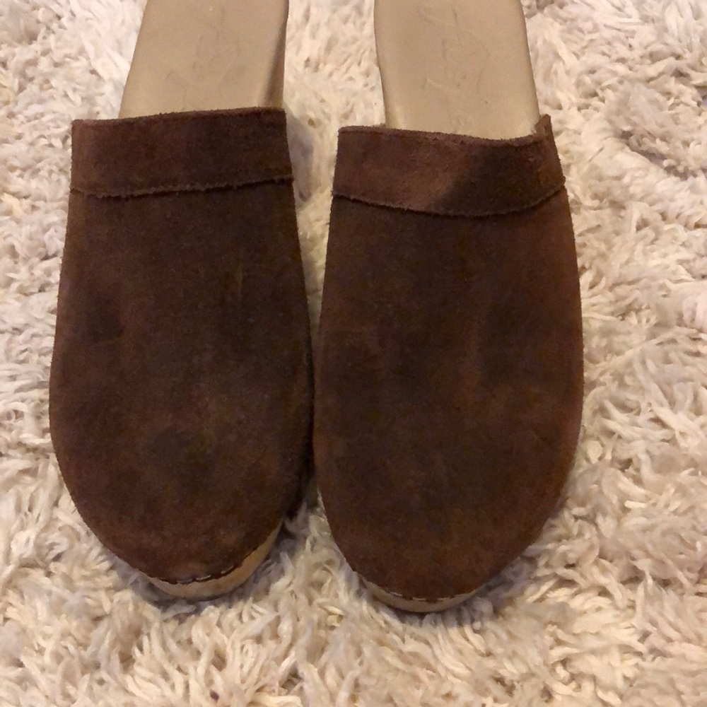 Suede clogs with wood heel.